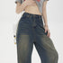 Close-up of high-waisted wide-leg jeans with decorative side stripes paired with cropped grey t-shirt and silver chain accessories