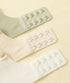 Close-up of three hidden hook-and-eye closures in matching colors, designed for a seamless look and adjustable fit.