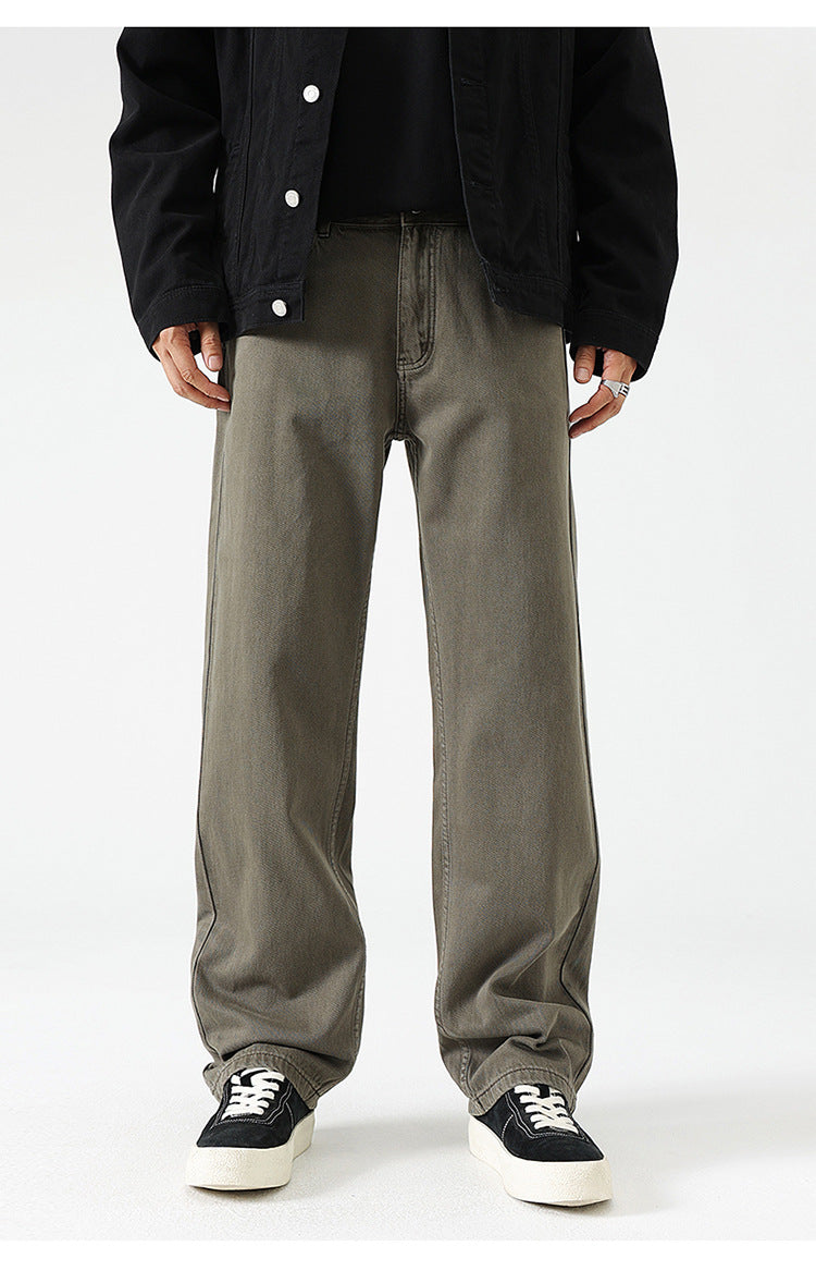 Olive green wide-leg pants with relaxed fit, paired with black top and white platform sneakers