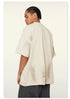 Back view highlighting texture of off-white Beattube t-shirt