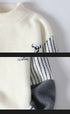 Close-up of sleeve showing logo and stripe pattern