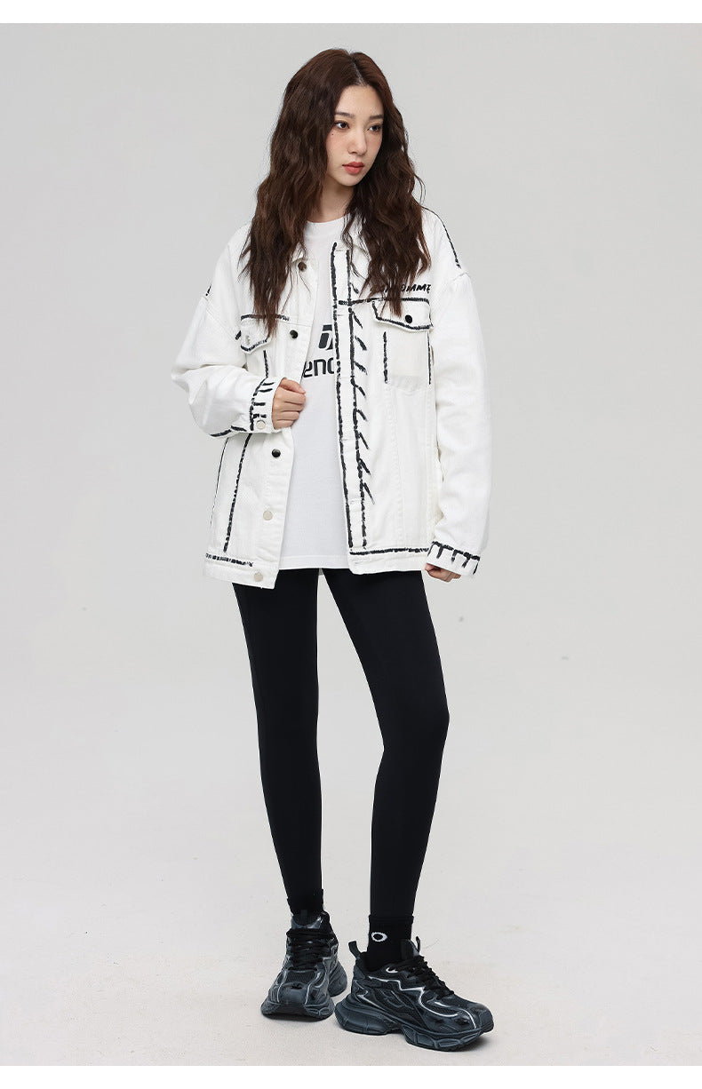 A woman is posing in full-length view. Wearing white SANHOMME outline denim jacket, white t-shirt, black leggings and chunky black sneakers