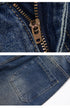 Close-up detail of medium wash denim jeans waistband showing metal button closure and belt loop construction with contrast stitching