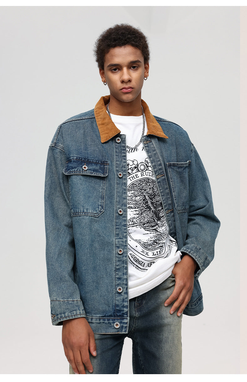 Close-up portrait of man in denim jacket with brown collar and white graphic tee showing "THE RULE" text