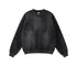 Washed black crewneck sweatshirt with vintage finish, plain front without graphics, ribbed collar, white tag visible, product photography