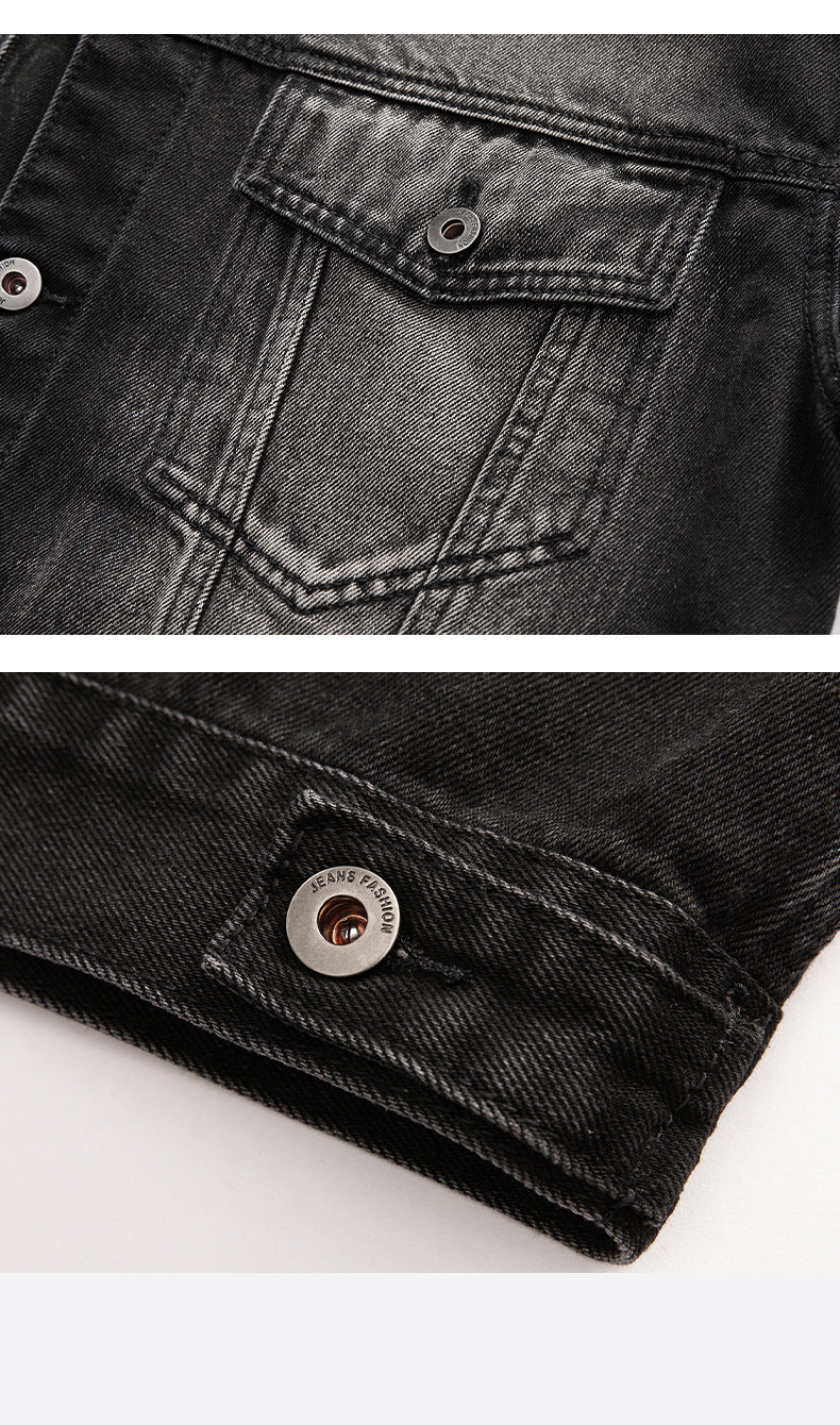 Detailed shots of the front pocket stitching and metal button hardware on the black washed denim jacket