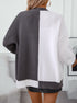 Back view of split-design cardigan showing vertical gray and white color blocking