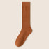 Single camel brown knee-high sock displayed showing full length and texture