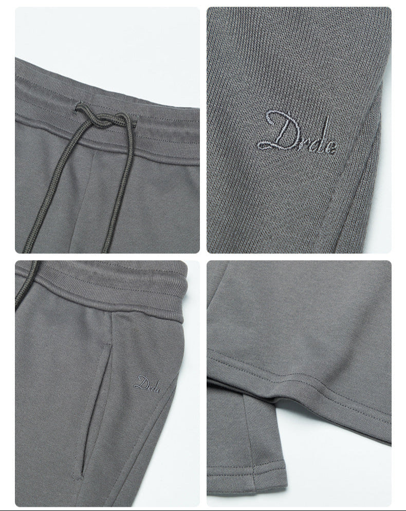 Gray sweatpants detail shots showing drawstring waistband and Drele logo embroidery