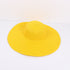 Yellow wide-brimmed sun hat with a structured design, laid flat against a white background.