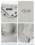 Design detail collage of light gray sweatshirt showing four features: snap-button hood with Nariele label, embossed eye logo, ribbed hem detail, and cuff construction
