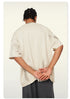 Rear perspective of loose-fitting Beattube t-shirt with distressed texture