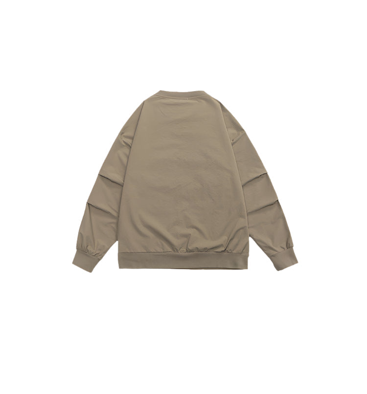 Flat-lay of the back of the beige sweatshirt, showcasing its minimalist style and easy-to-match design