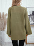 Back view of olive cardigan showing full chevron knit pattern and bell-shaped sleeve design