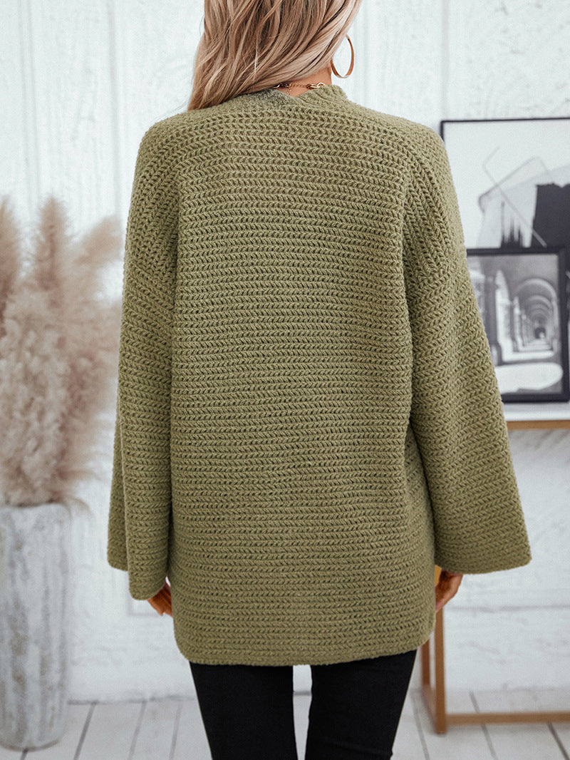 Back view of olive cardigan showing full chevron knit pattern and bell-shaped sleeve design