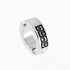Silver stainless steel huggie earring with geometric spiral pattern against white background