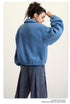 Back view of blue fleece jacket with puffy sleeves