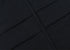 Close-up of black fabric showing seam detail and panel construction against neutral background
