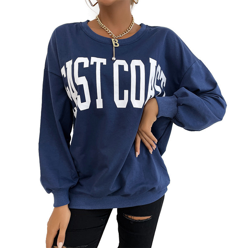 Lifestyle shot of East Coast sweatshirt with distressed denim styling