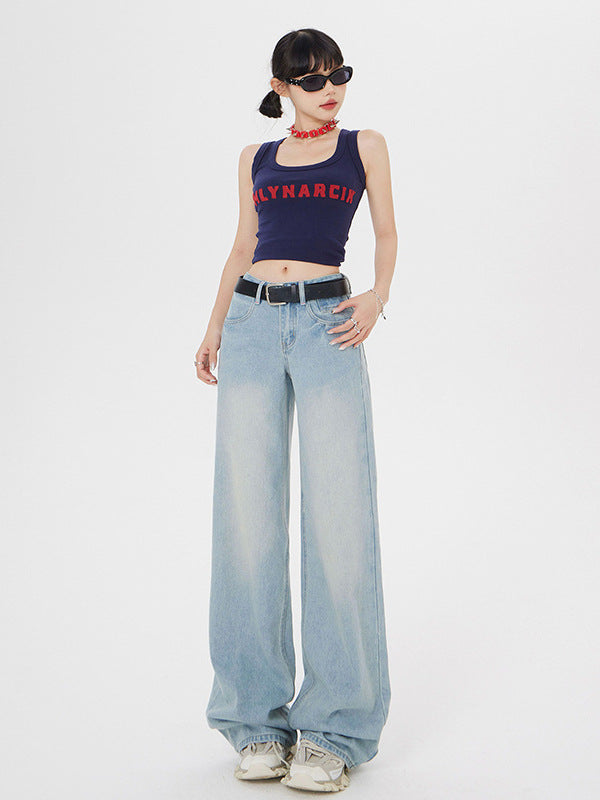 Front-facing model in navy MLYNARCIN tank, wide-leg jeans, red choker, and sunglasses on white background