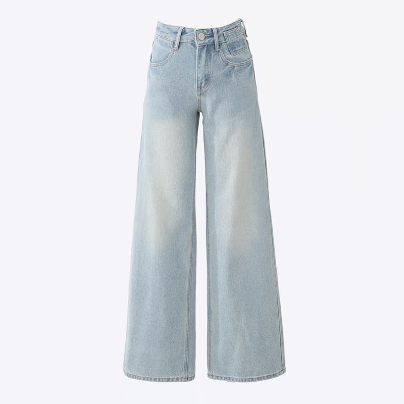 Product shot of light wash wide-leg jeans laying flat, showing high-waist design and full-length silhouette
