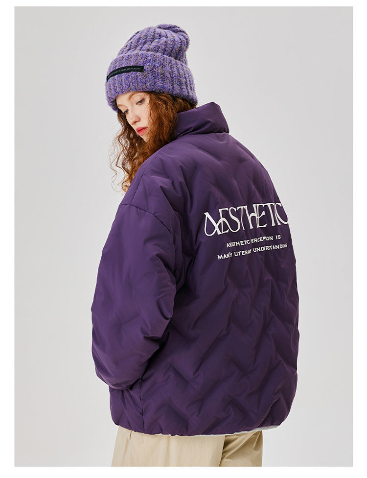 Back view of woman wearing purple Aesthetic puffer jacket featuring brand text logo, styled with purple knit beanie and khaki pants