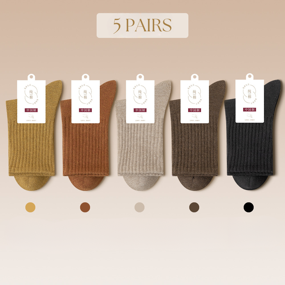 Five pairs of neutral toned socks arranged with color dots showing shade variations