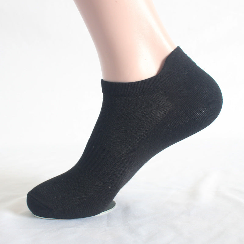 Black athletic ankle sock on mannequin foot showing cushioned sole