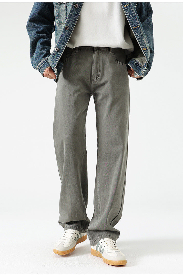 Display of wide-leg jeans in various colors from beige to purple, showcasing range of options