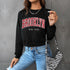 Styled outfit featuring Brooklyn sweatshirt with zebra print bag, chain necklace and high-rise jeans