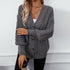 Chunky gray cardigan with ribbed detailing and cable pattern, styled casually with white cami and statement gold necklaces