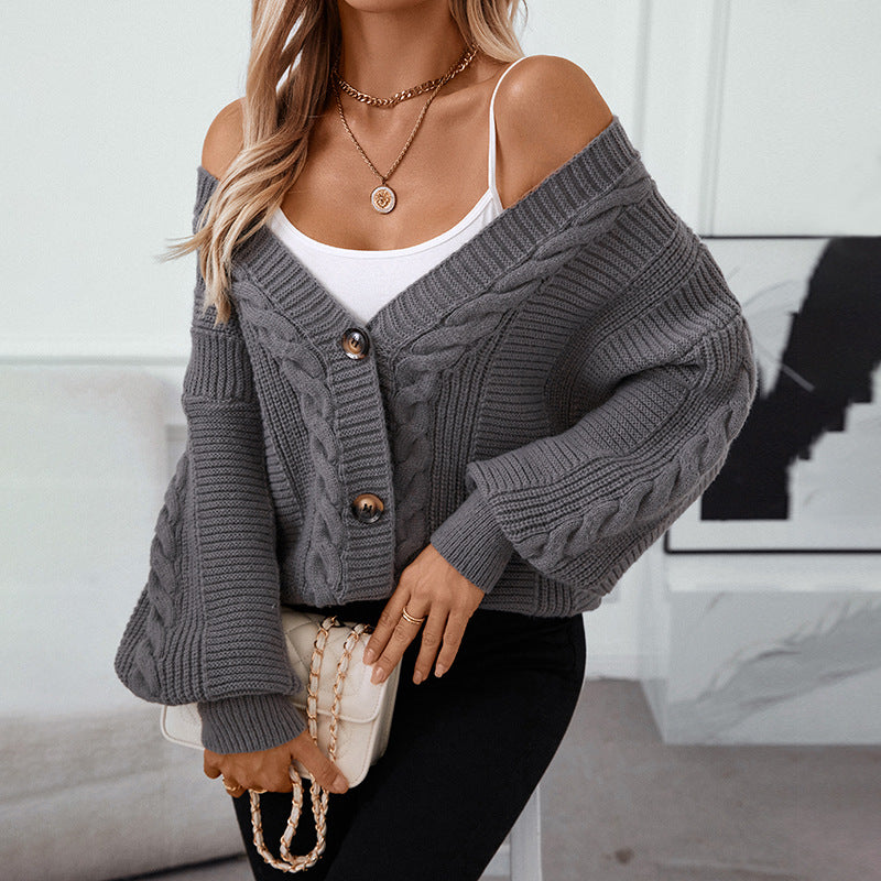 Cozy gray cardigan with balloon sleeves paired with cream quilted handbag and gold jewelry for elevated casual style