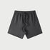 Charcoal gray elastic waist shorts with drawstring displayed flat against light gray background