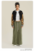 Black cropped varsity jacket with tan camouflage sleeves, white stripe trim, and embroidered collegiate-style logo