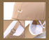 Close-up detail of embroidered corgi logo, adjustable strap, and interior construction of beige baseball cap