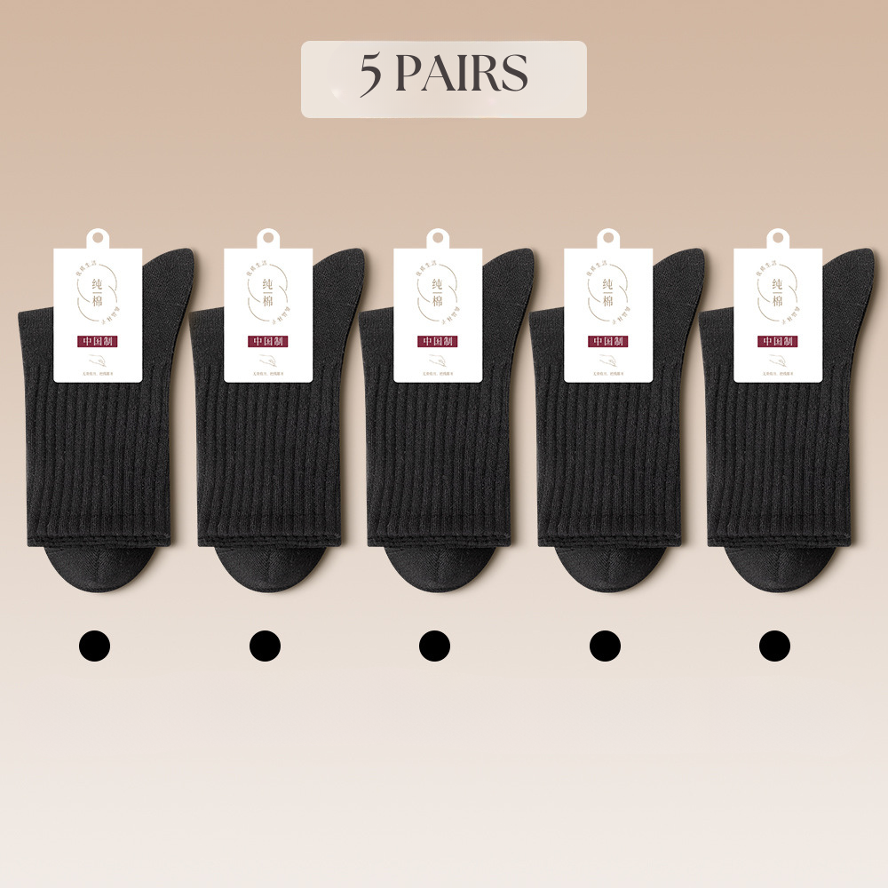 Five pairs of black cotton socks arranged with matching color identification dots