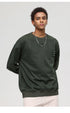Close-up portrait of male model in olive textured sweatshirt with silver chain necklace
