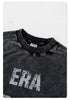 Close-up of black sweatshirt neckline showing 'BE THRIVED' label and 'ERA' distressed print