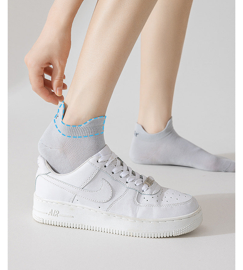 Demonstration of sock fit with white sneaker, highlighting antibacterial and breathable properties