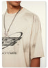 Detailed view of distressed print on white Beattube t-shirt