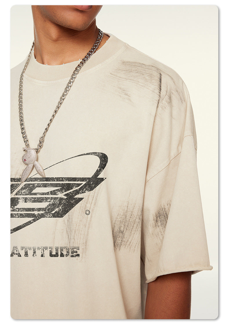 Detailed view of distressed print on white Beattube t-shirt