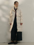 Long white puffer coat with high collar, styled with turtleneck and wide-leg pants, classic minimalist winter look