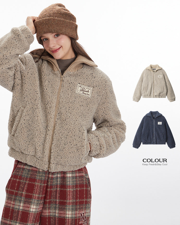 Model adjusting beanie while wearing beige sherpa jacket with Marule logo patch. Shown with color options and plaid pants