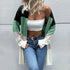 Color-block cardigan in black, green, white. White crop top, jeans, gold belt