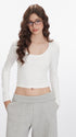 Product layout featuring white long-sleeve crop top worn with light gray wide-leg pants.
