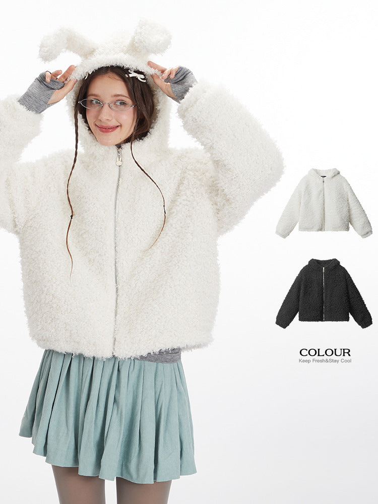 White fluffy hooded jacket with bunny ear details, paired with sage green pleated skirt and gray gloves, COLOUR brand product image