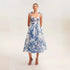 White and blue floral organza midi dress with bustier bodice and bow-tie straps, perfect for elegant summer events
