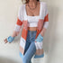 Color-block cardigan in white, orange, pink, blue. White crop top, jeans, chain necklace