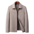 Beige lightweight wool zippered jacket with subtle textured pattern and stand collar displayed on wooden hanger