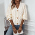 Ivory button-up cardigan with textured knit, model wearing layered necklaces and blue jeans